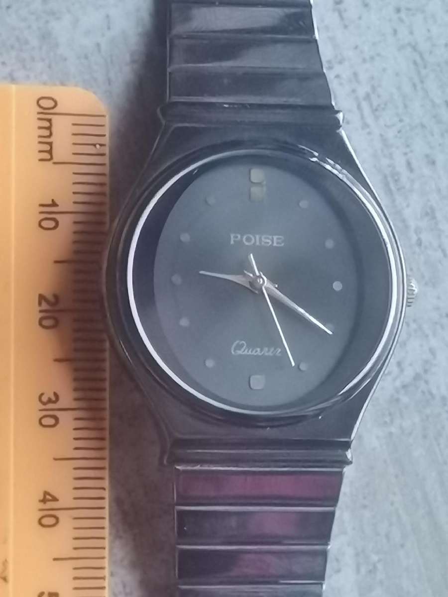 LADIES POISE ALL BLACK STAINLESS STEEL WATCH IN EXCELLENT WORKING CONDITION