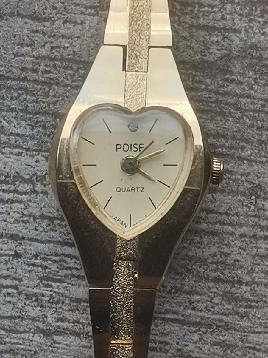 LADIES POISE HEART SHAPED GOLD WATCH IN EXCELLENT WORKING CONDITION