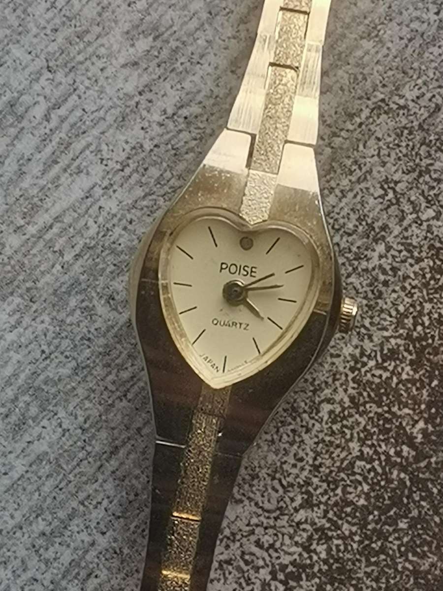 LADIES POISE HEART SHAPED GOLD WATCH IN EXCELLENT WORKING CONDITION