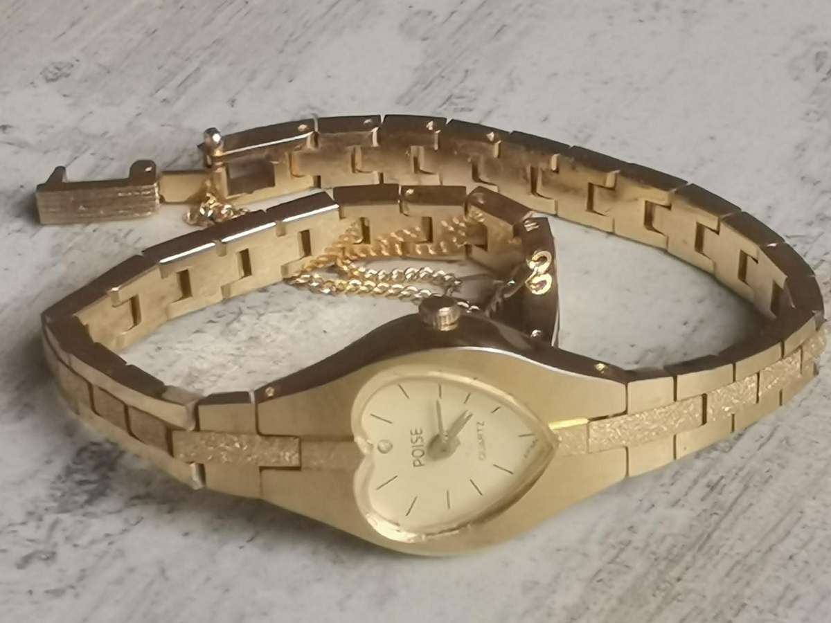 LADIES POISE HEART SHAPED GOLD WATCH IN EXCELLENT WORKING CONDITION