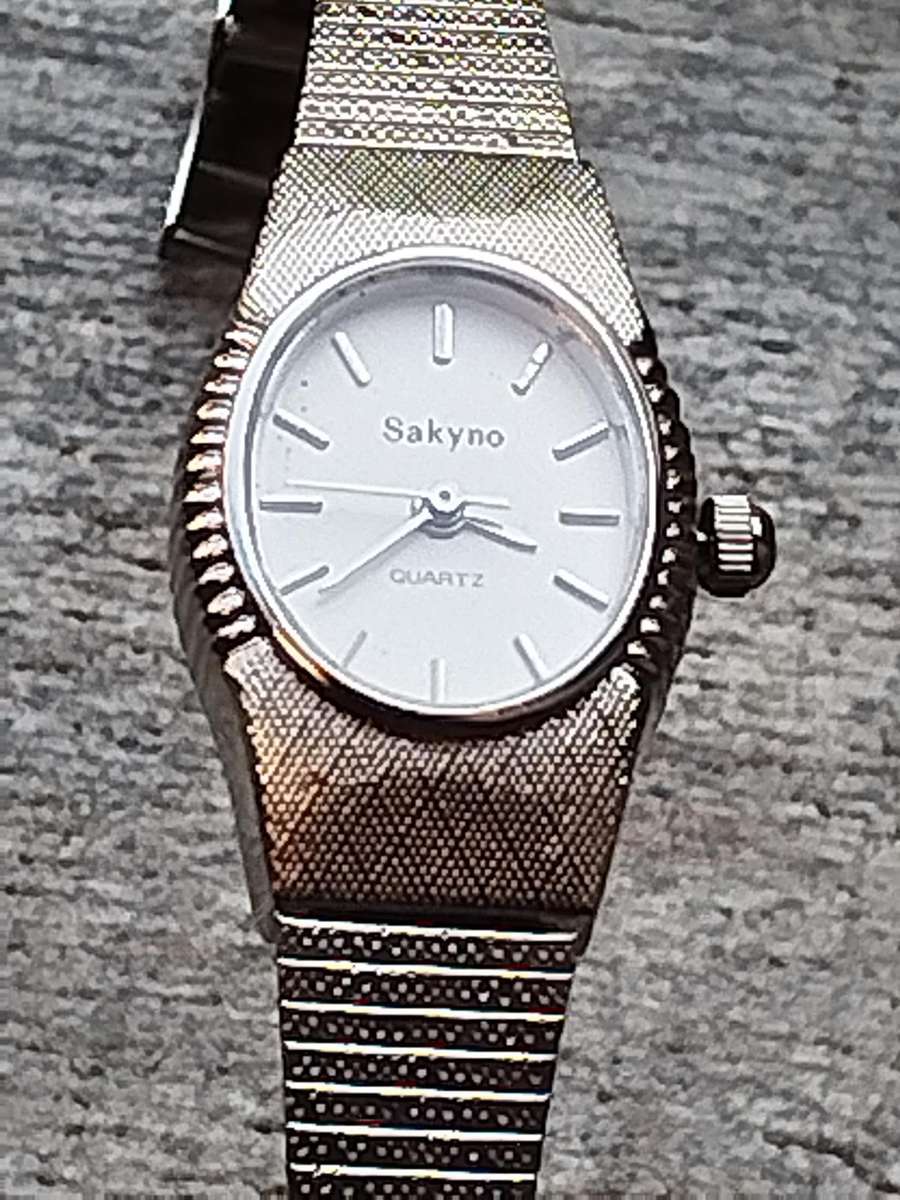 LADIES SAKYNO STAINLESS STEEL WATCH IN EXCELLENT WORKING CONDITION