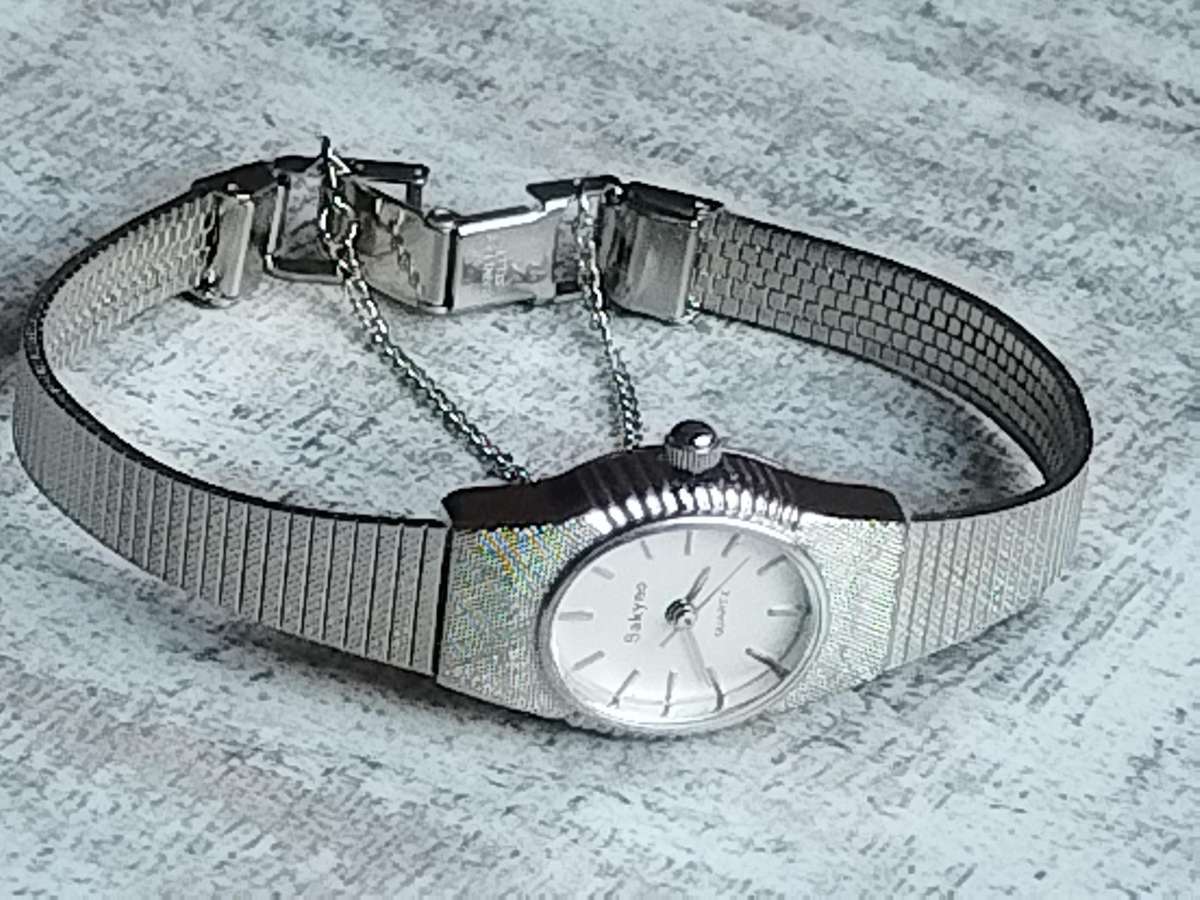 LADIES SAKYNO STAINLESS STEEL WATCH IN EXCELLENT WORKING CONDITION