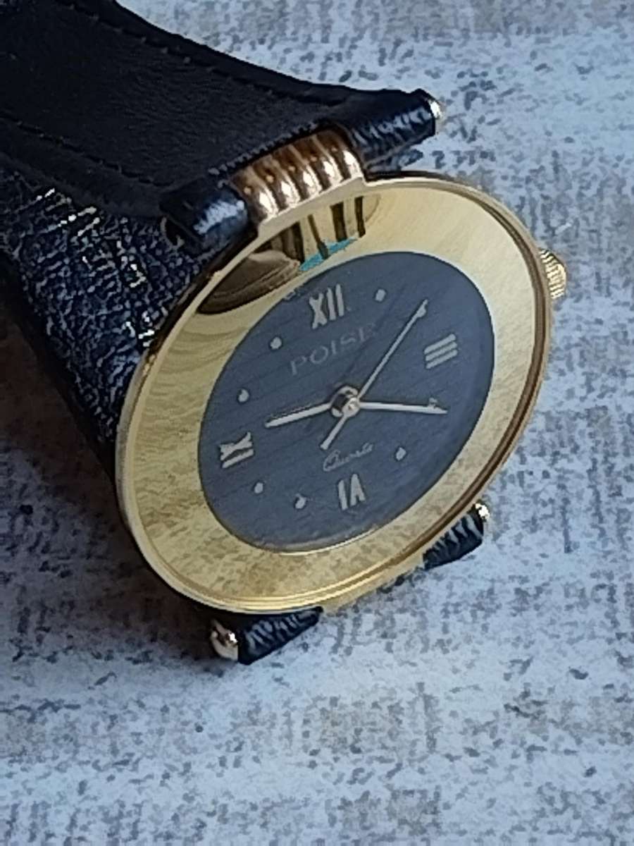STUNNING AND ELEGANT LADIES POISE GOLD WATCH IN EXCELLENT WORKING CONDITION