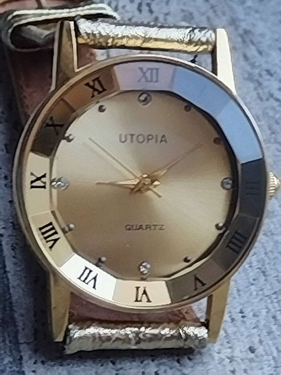 STUNNING AND ELEGANT LADIES UTOPIA ALL GOLD WATCH IN EXCELLENT WORKING CONDITION