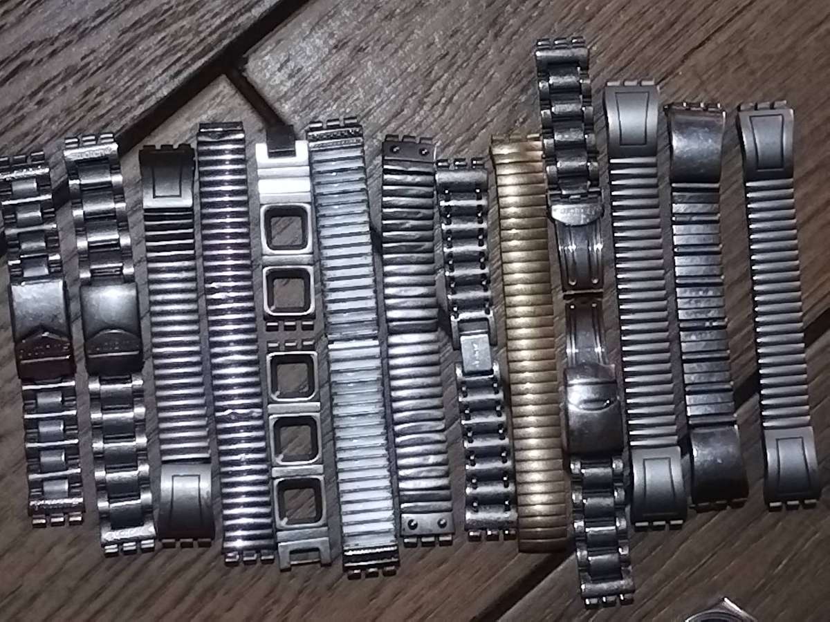 SWATCH WATCH CASINGS AND STRAPS - BIDDING FOR ALL