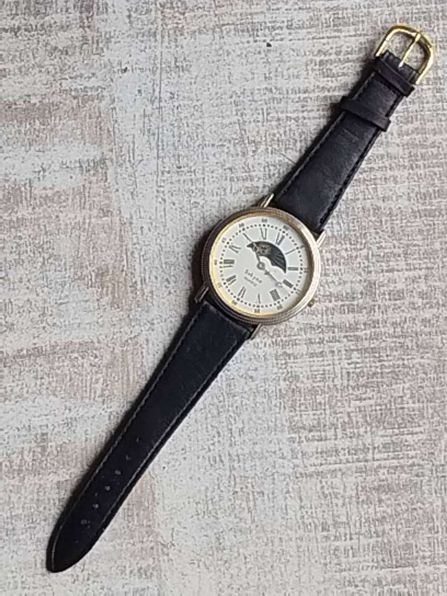 LADIES SAKYNO SUN AND MOON ROTATING WATCH IN EXCELLENT WORKING CONDITION