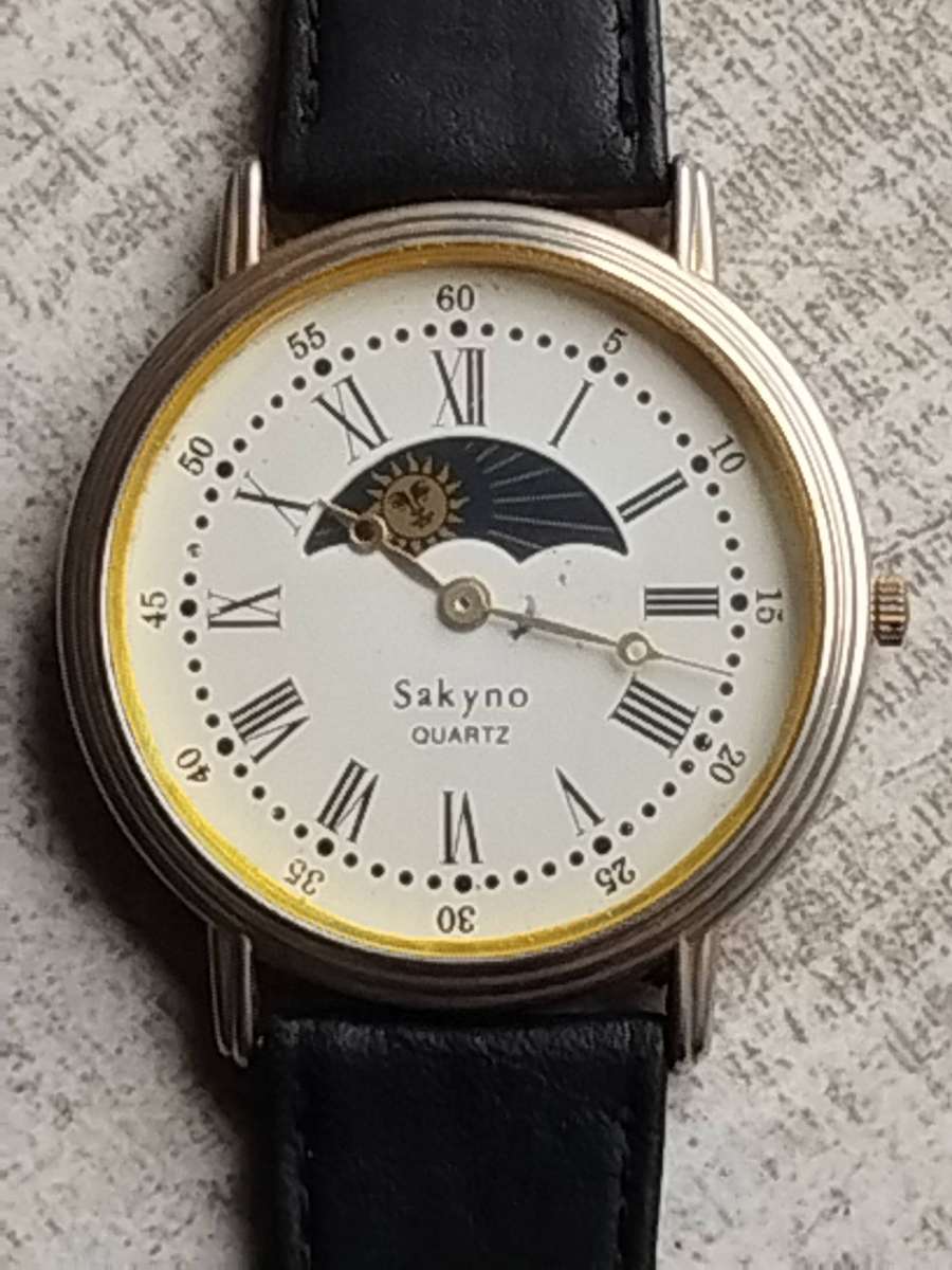 LADIES SAKYNO SUN AND MOON ROTATING WATCH IN EXCELLENT WORKING CONDITION