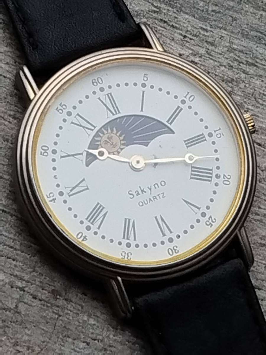 LADIES SAKYNO SUN AND MOON ROTATING WATCH IN EXCELLENT WORKING CONDITION