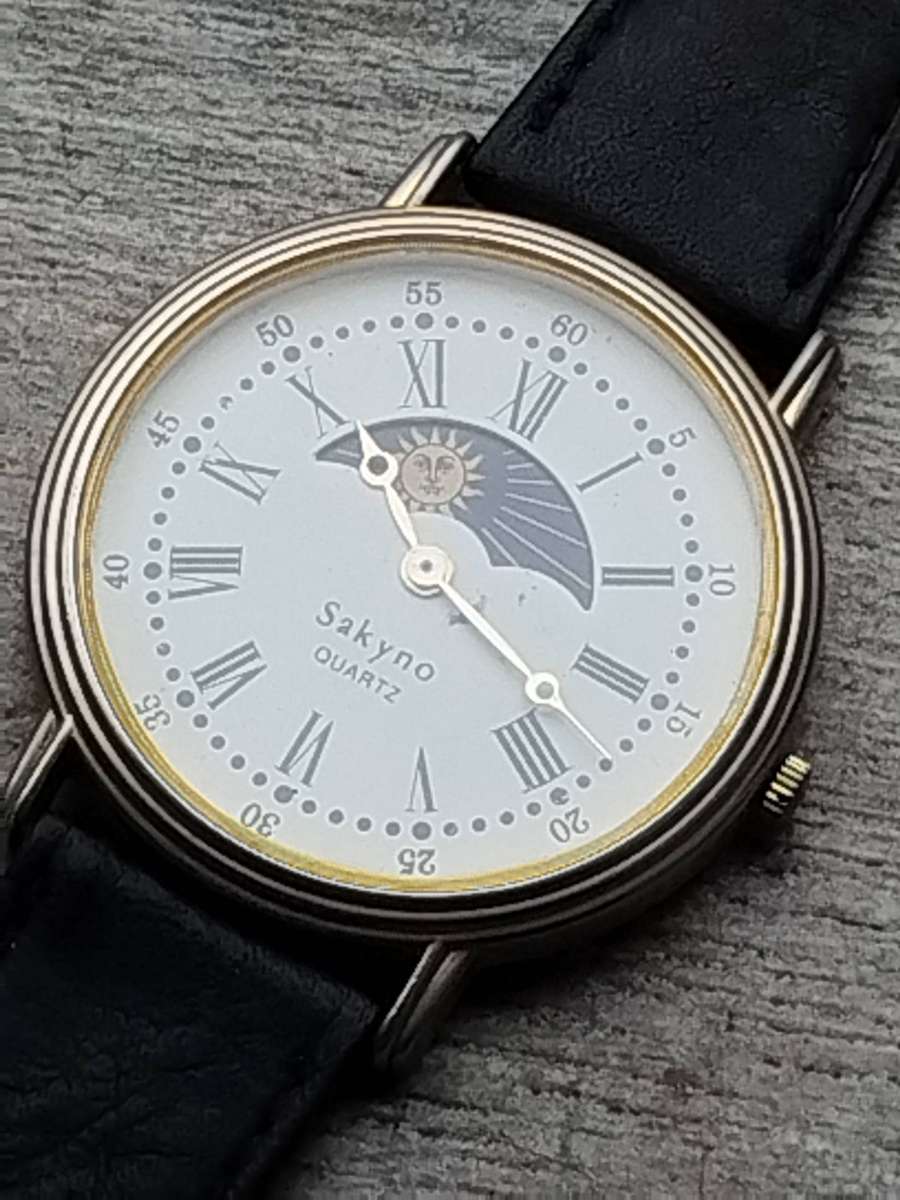 LADIES SAKYNO SUN AND MOON ROTATING WATCH IN EXCELLENT WORKING CONDITION