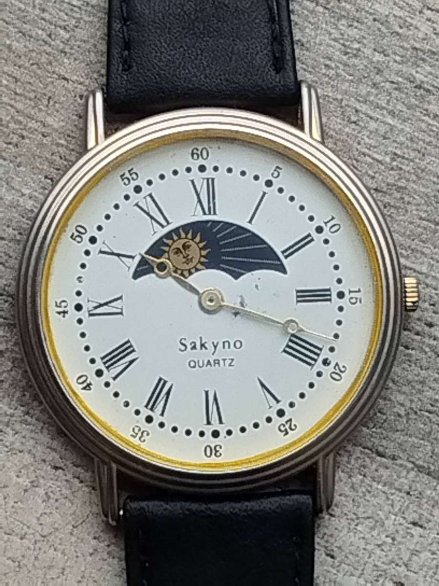 LADIES SAKYNO SUN AND MOON ROTATING WATCH IN EXCELLENT WORKING CONDITION
