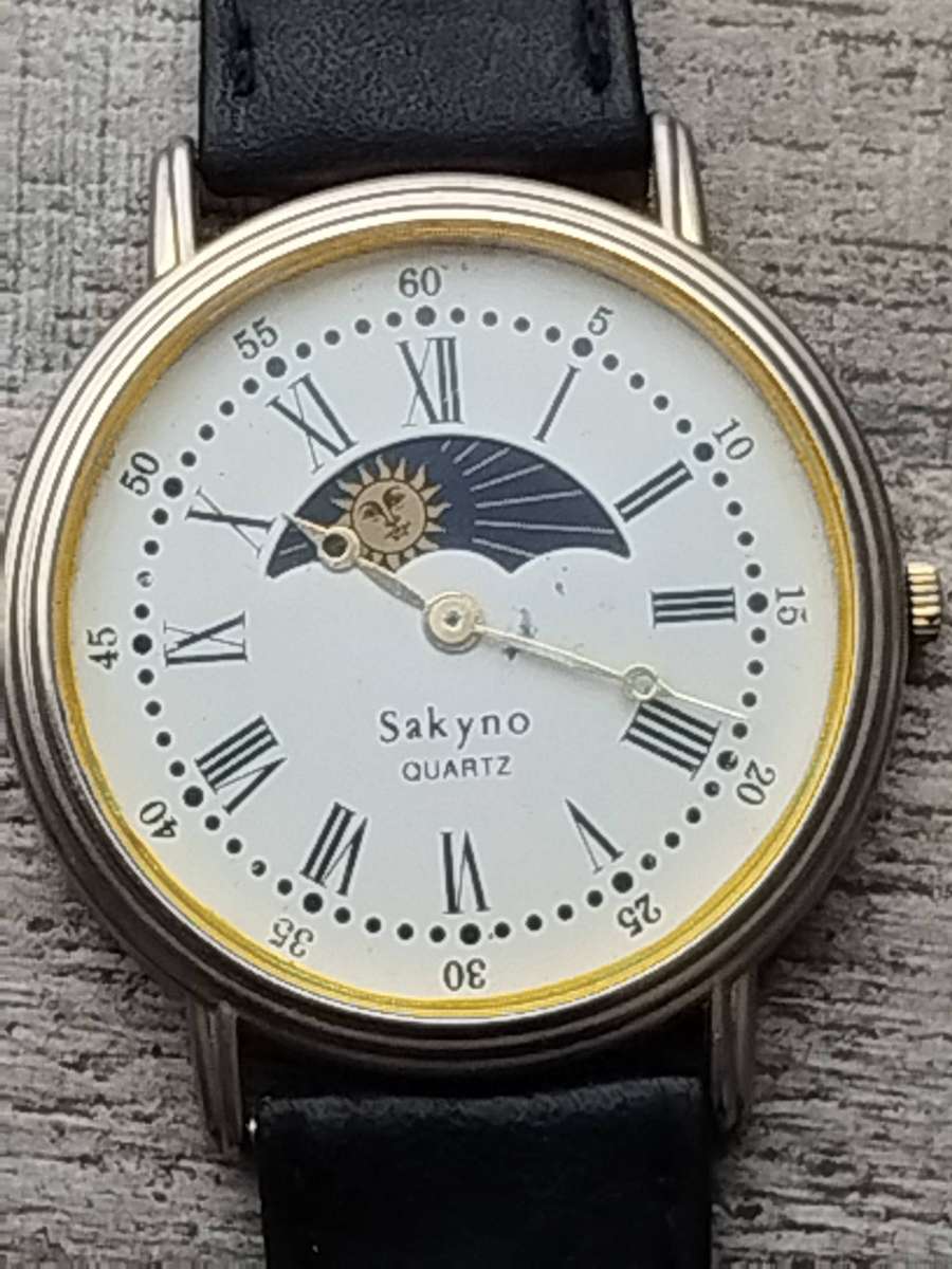 LADIES SAKYNO SUN AND MOON ROTATING WATCH IN EXCELLENT WORKING CONDITION