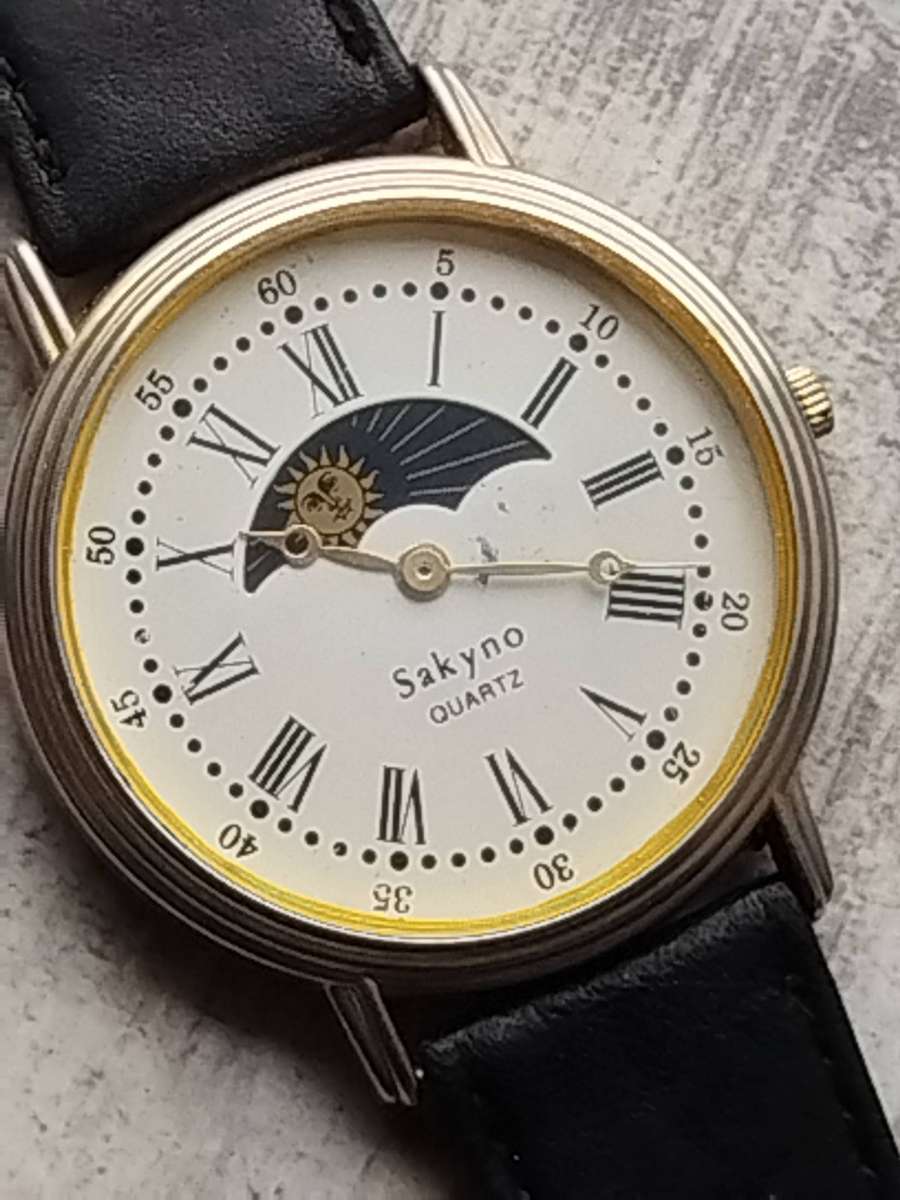 LADIES SAKYNO SUN AND MOON ROTATING WATCH IN EXCELLENT WORKING CONDITION