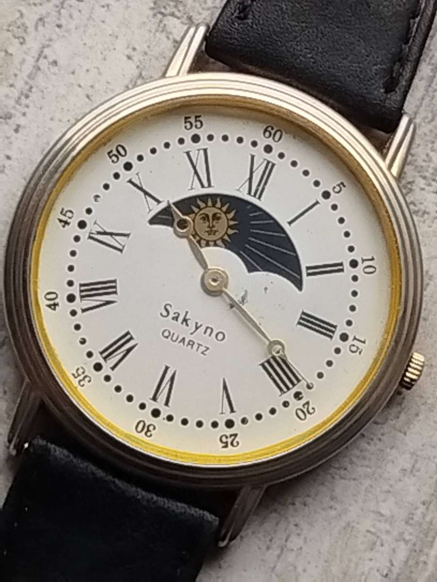 LADIES SAKYNO SUN AND MOON ROTATING WATCH IN EXCELLENT WORKING CONDITION