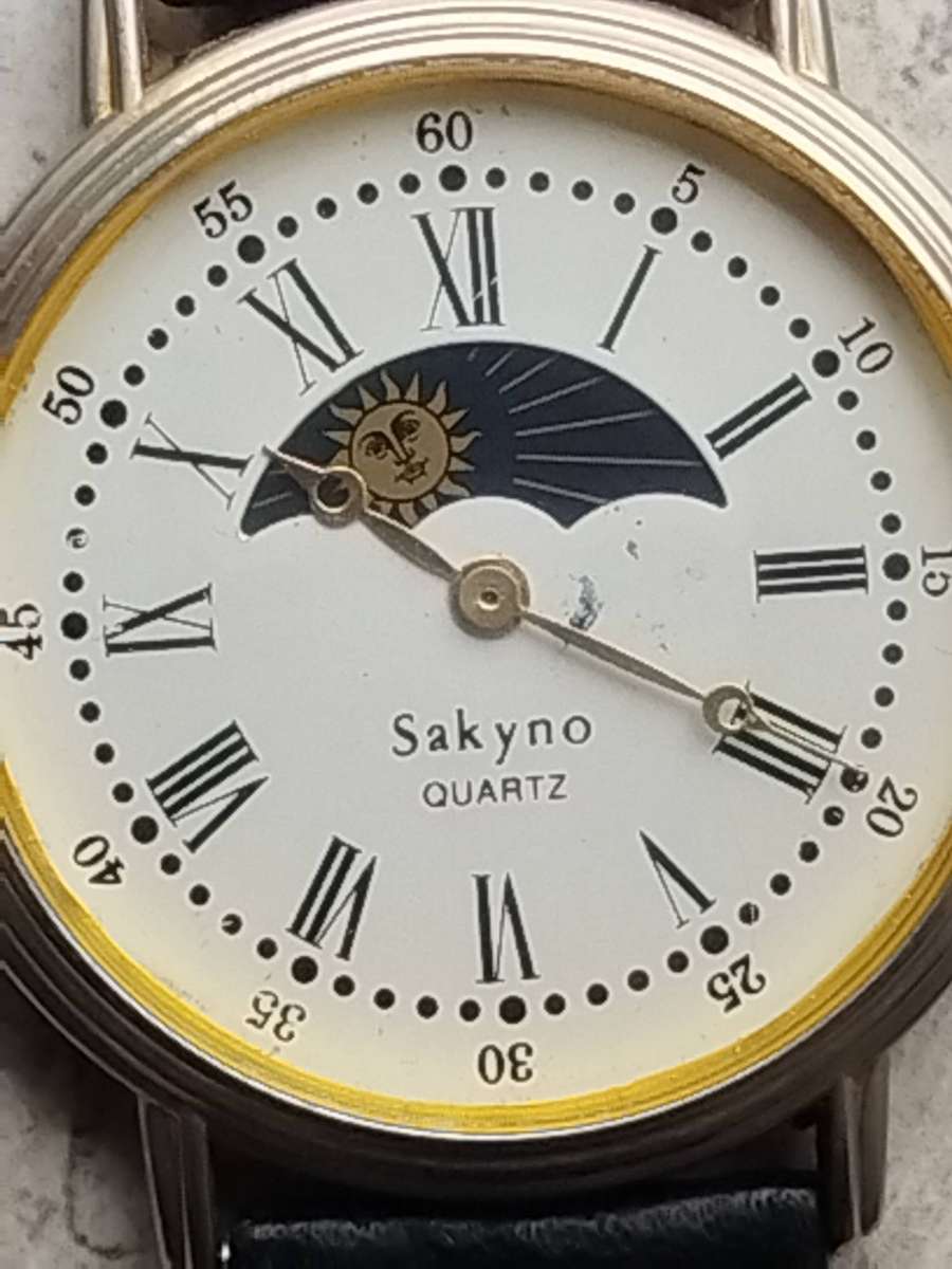 LADIES SAKYNO SUN AND MOON ROTATING WATCH IN EXCELLENT WORKING CONDITION