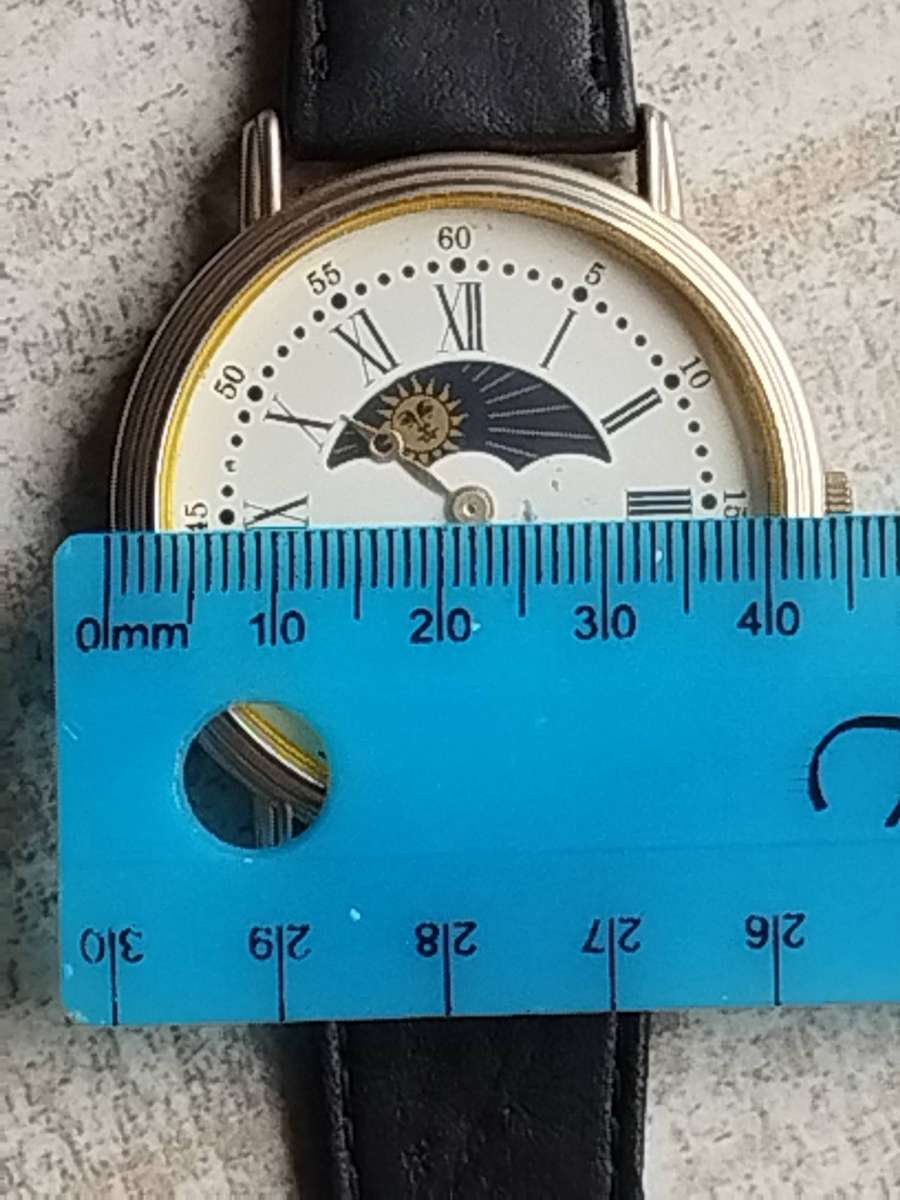 LADIES SAKYNO SUN AND MOON ROTATING WATCH IN EXCELLENT WORKING CONDITION