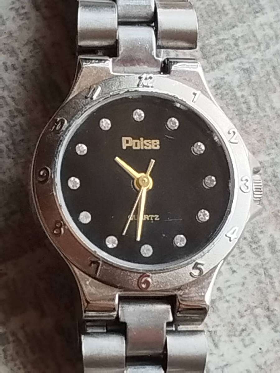 LADIES POISE STAINLESS STEEL WATCH IN EXCELLENT WORKING CONDITION