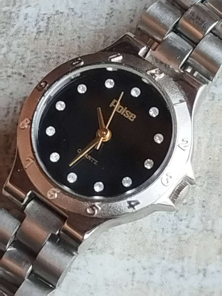 LADIES POISE STAINLESS STEEL WATCH IN EXCELLENT WORKING CONDITION