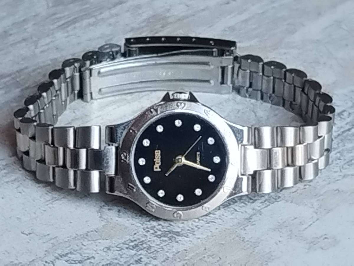 LADIES POISE STAINLESS STEEL WATCH IN EXCELLENT WORKING CONDITION