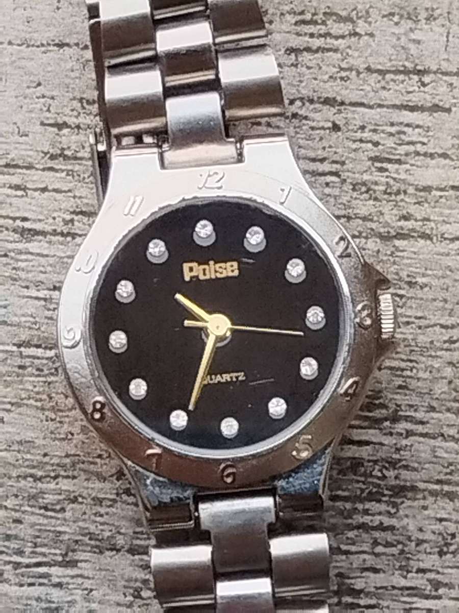 LADIES POISE STAINLESS STEEL WATCH IN EXCELLENT WORKING CONDITION