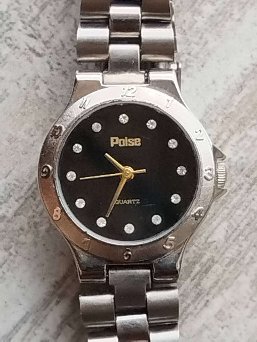 LADIES POISE STAINLESS STEEL WATCH IN EXCELLENT WORKING CONDITION