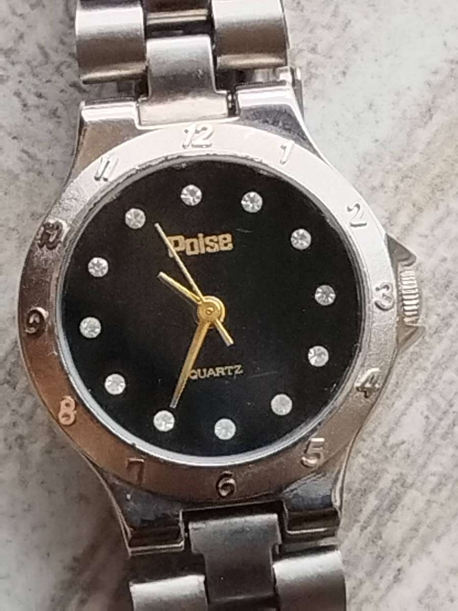 LADIES POISE STAINLESS STEEL WATCH IN EXCELLENT WORKING CONDITION