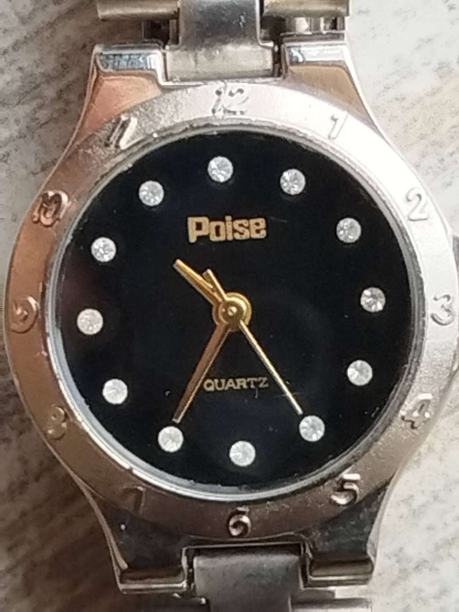 LADIES POISE STAINLESS STEEL WATCH IN EXCELLENT WORKING CONDITION