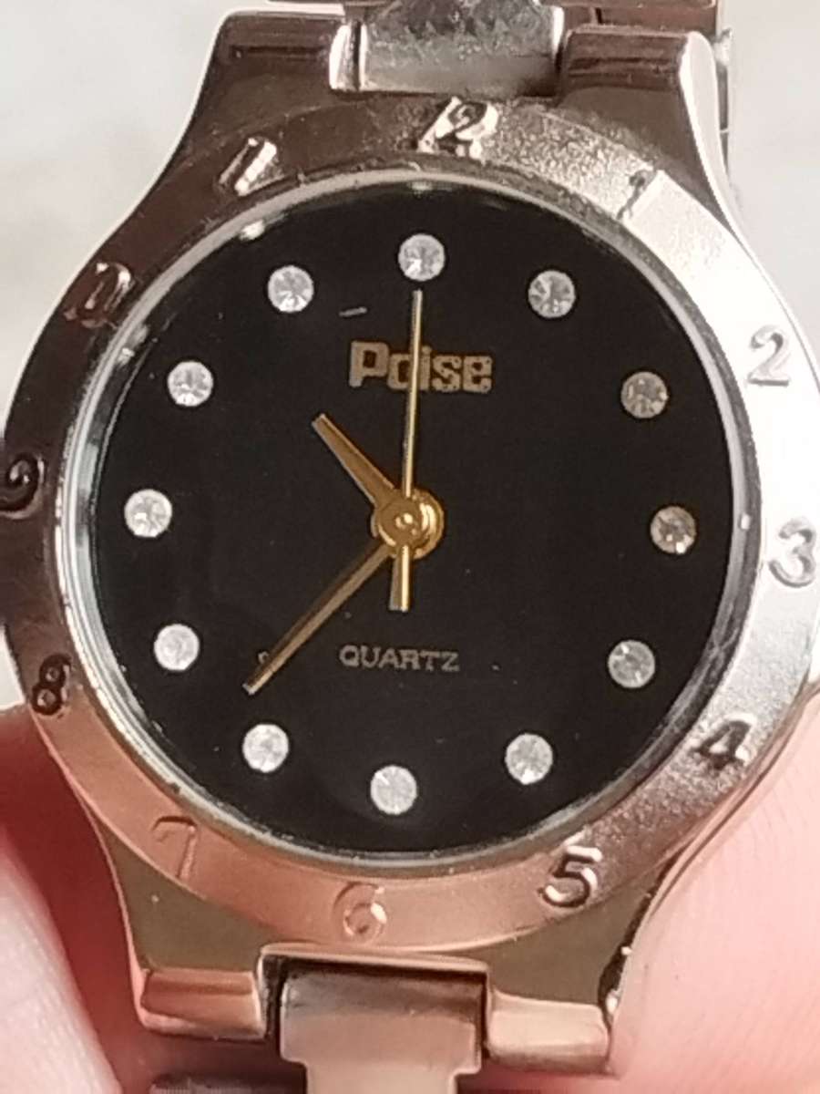 LADIES POISE STAINLESS STEEL WATCH IN EXCELLENT WORKING CONDITION