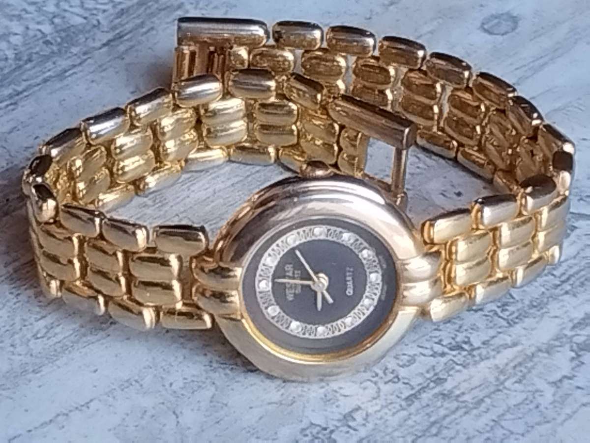 LADIES WESTAR GOLD WATCH IN EXCELLENT WORKING CONDITION