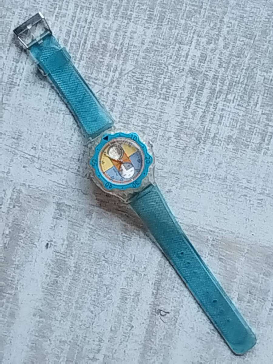 MENS FLASH SPORTS WATCH WITH ROTATING BEZEL AND SEE-THROUGH BACK IN EXCELLENT WORKING CONDITION