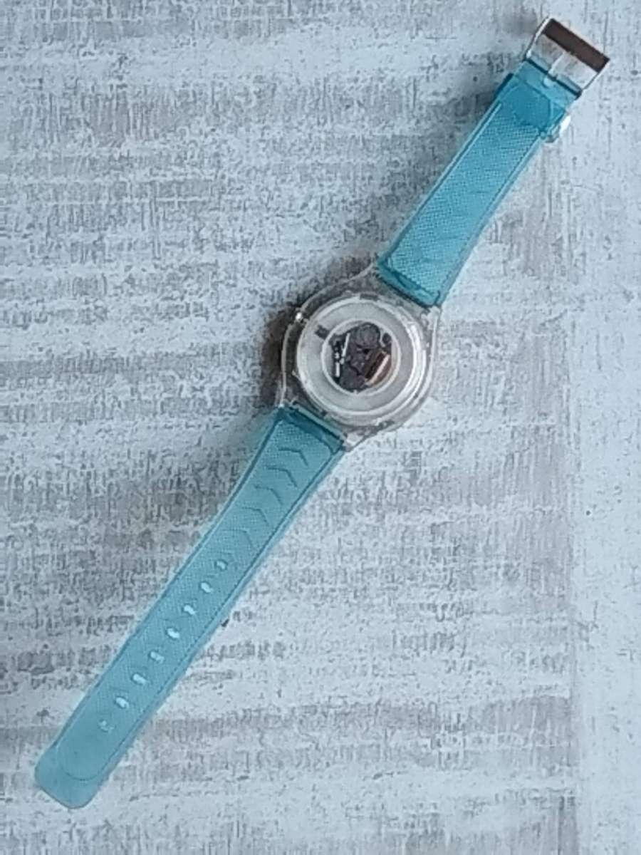 MENS FLASH SPORTS WATCH WITH ROTATING BEZEL AND SEE-THROUGH BACK IN EXCELLENT WORKING CONDITION
