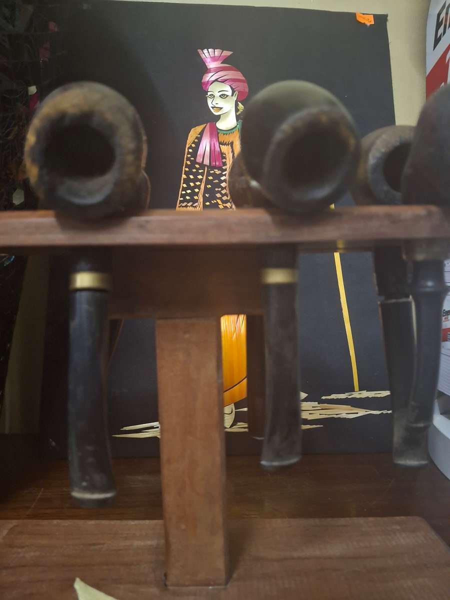 Wooden pipes on stand