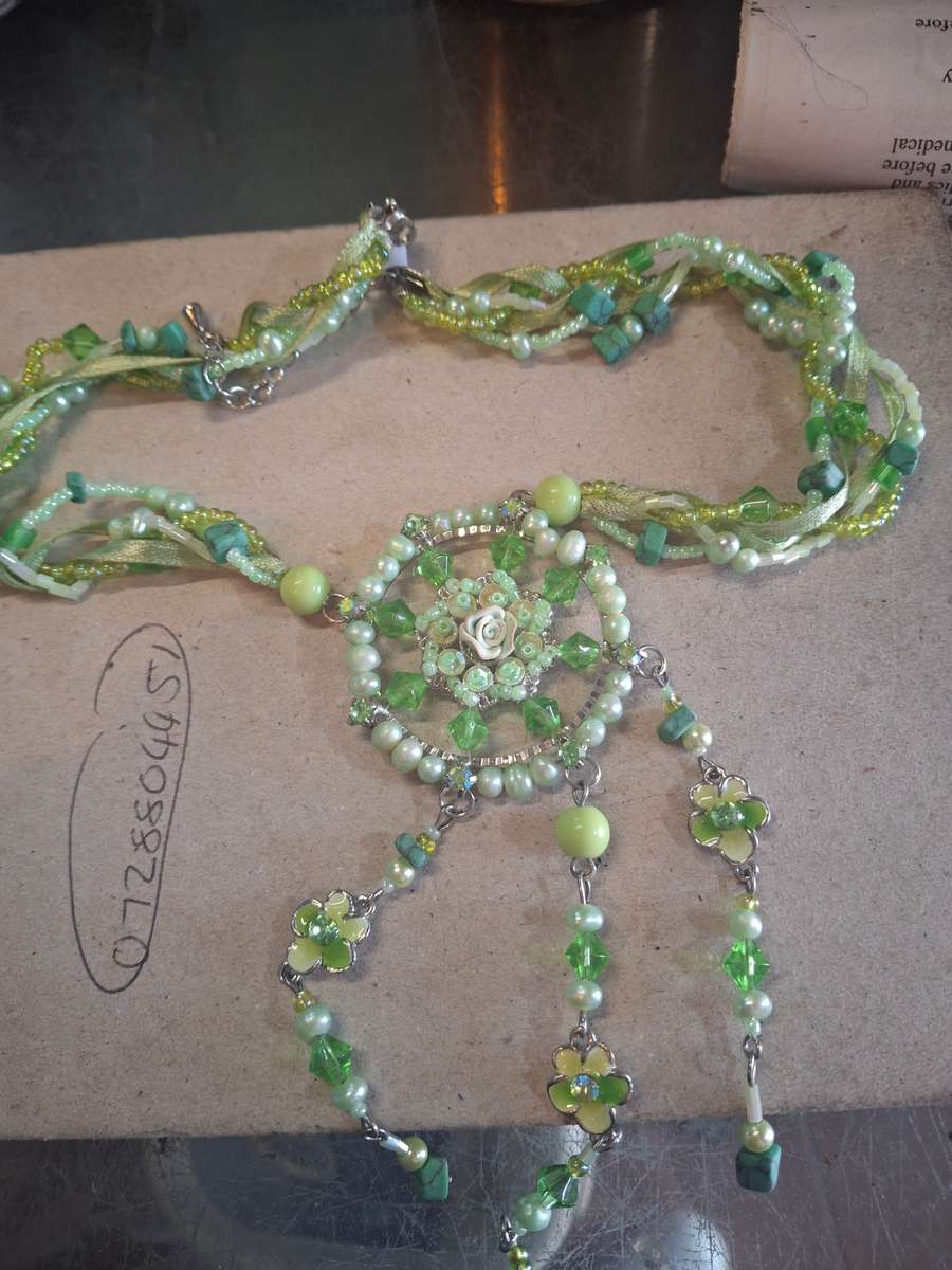 Green pretty costume necklace with flowers