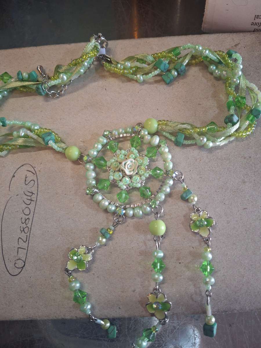 Green pretty costume necklace with flowers