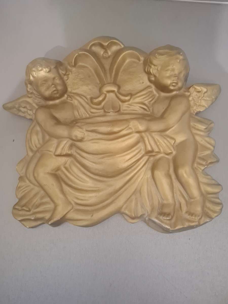 Plaster of paris cherub wall mount