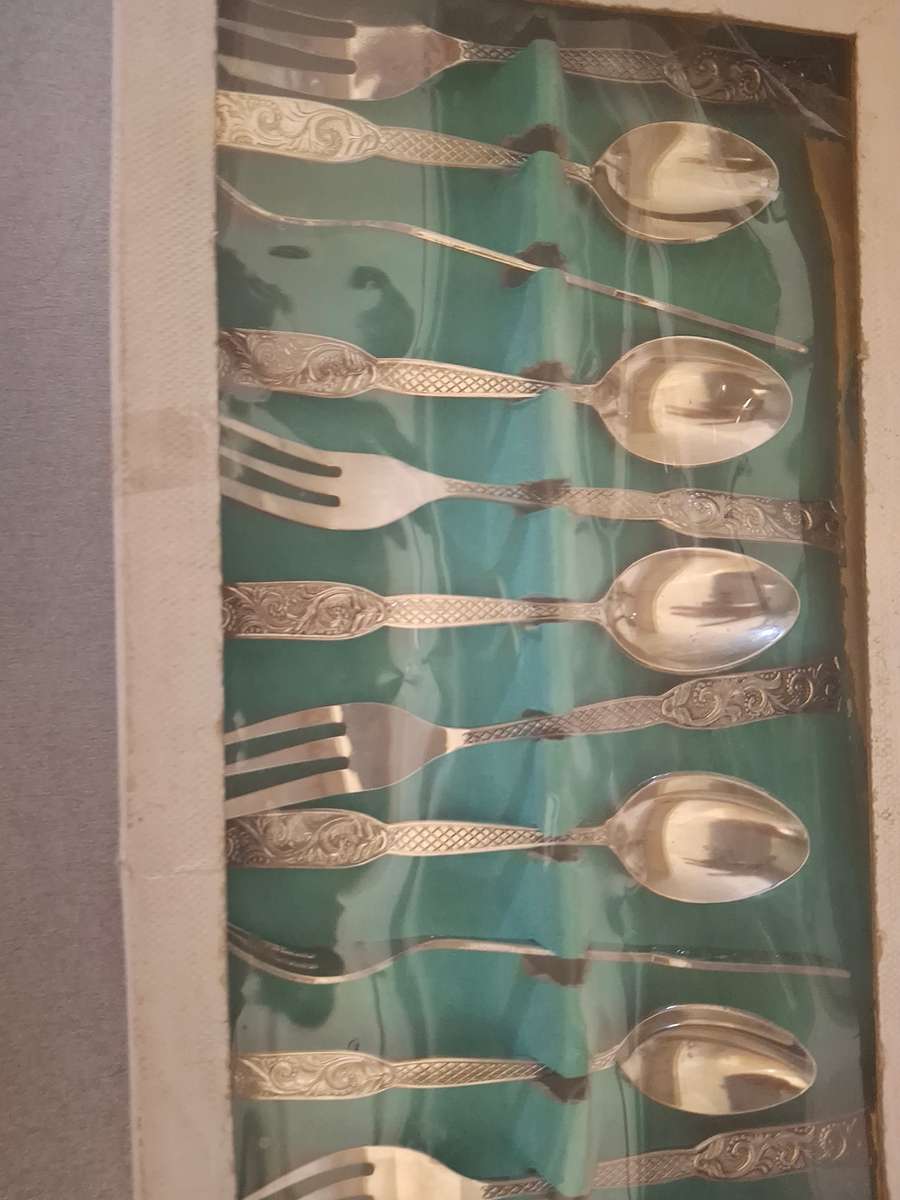 Boxed vintage stainless steel tea spoons and cake forks