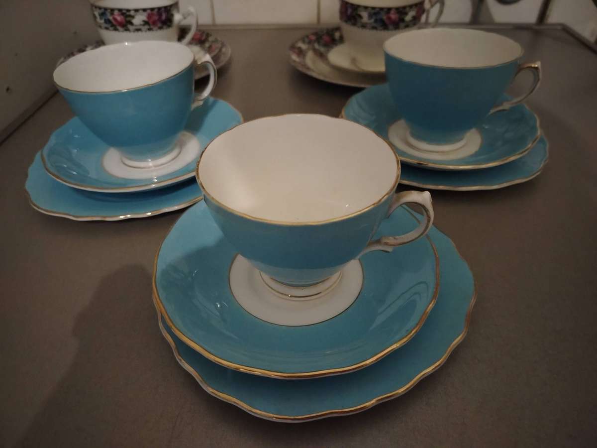 Five assorted tea cup trios
