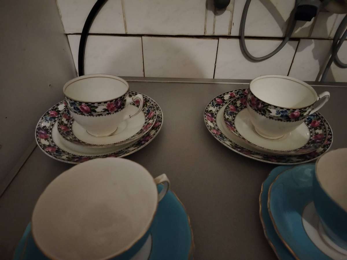 Five assorted tea cup trios