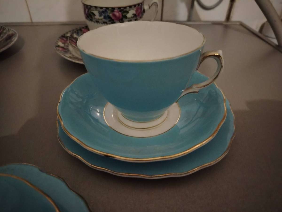Five assorted tea cup trios