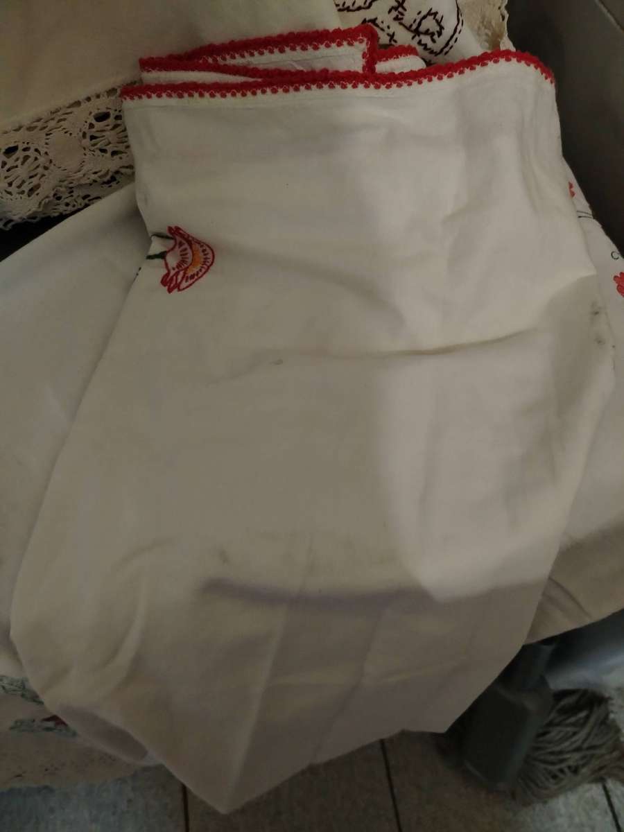 A Wooden storage box with table linen and etc