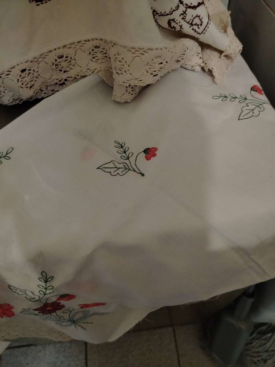 A Wooden storage box with table linen and etc