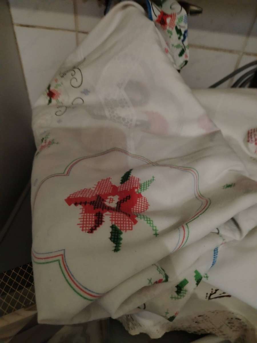 A Wooden storage box with table linen and etc