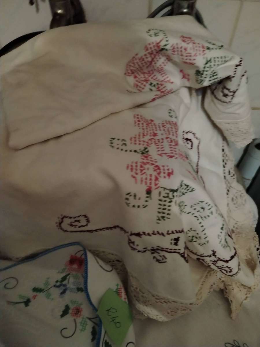 A Wooden storage box with table linen and etc