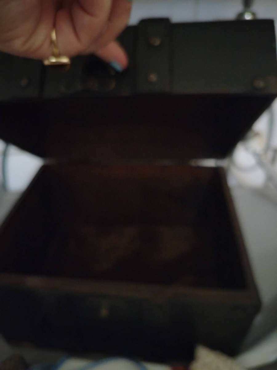 A Wooden storage box with table linen and etc