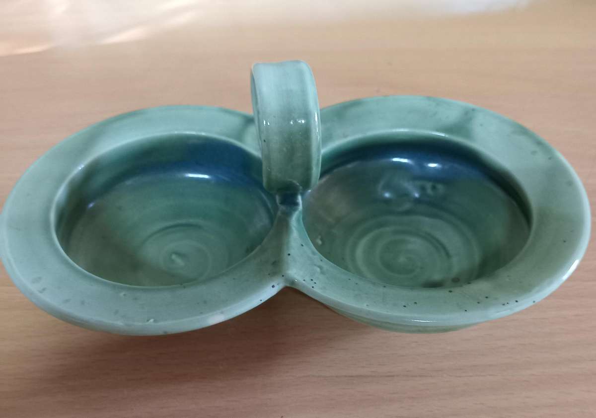 Double compelled pottery