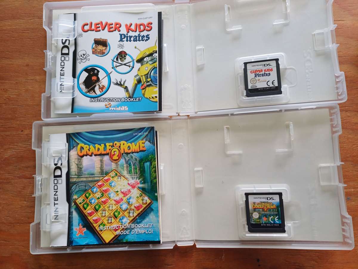 Nintendo DS Bundle (Console Charger and 2 games)