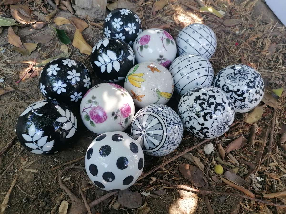 13 ceramic decor balls. Bid per item