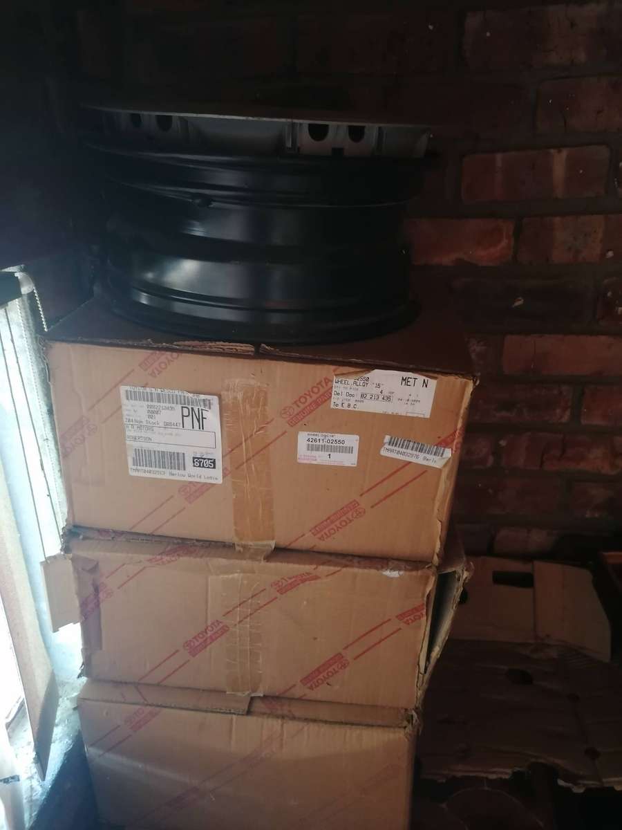 4 x Original Toyota rims with wheel caps. One 14" and 3 15"