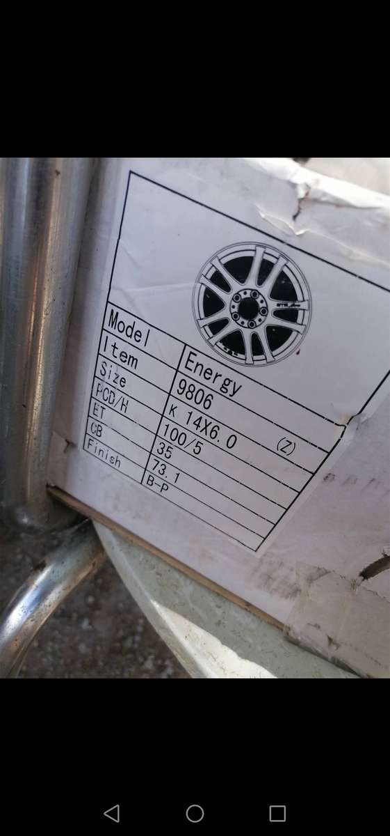4 x Original Toyota rims with wheel caps. One 14" and 3 15"