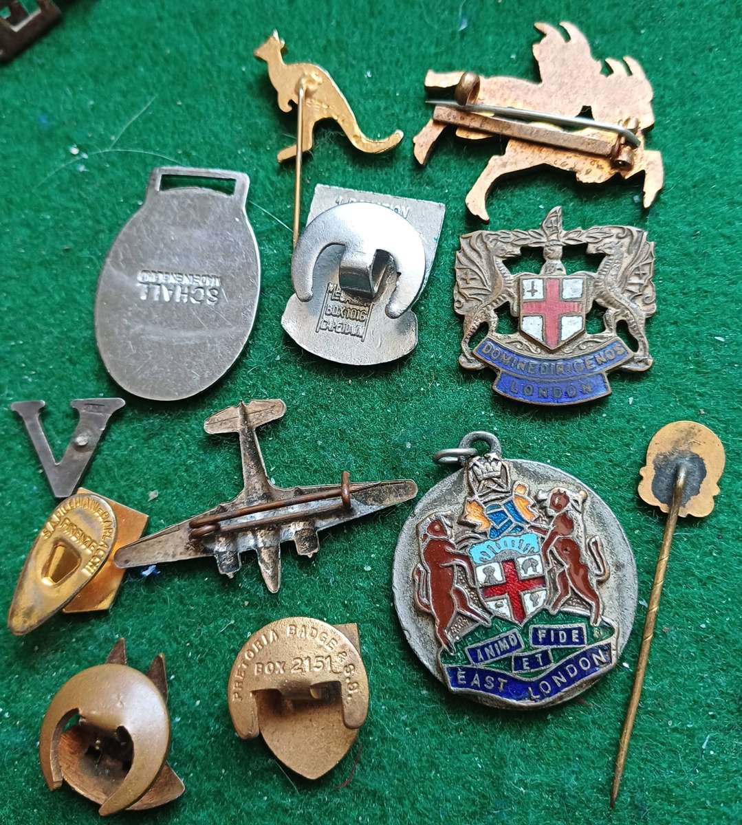 Selection of 12 badges as seen