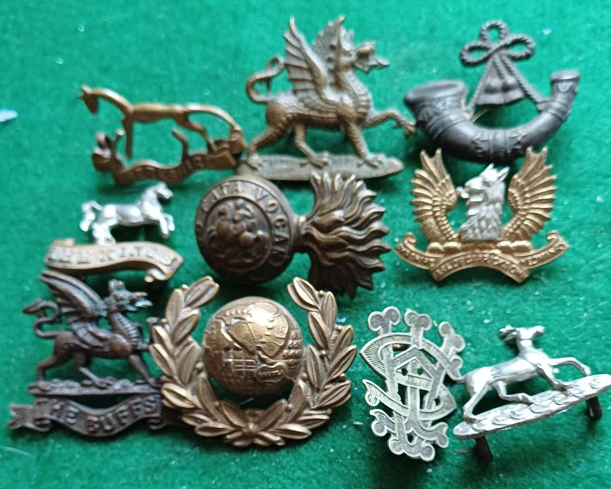 Selection of 10 military badges 3 inc Buffs Officers collar